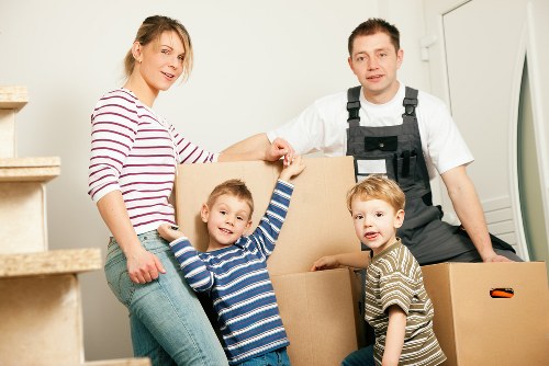 Furniture and boxes being loaded into a removal truck in Camden