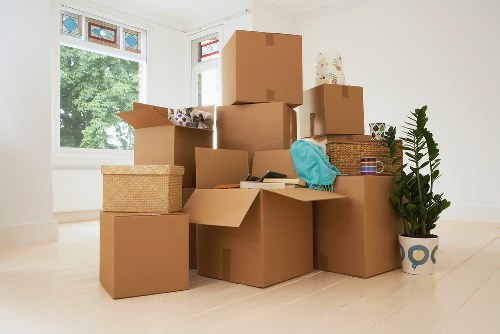 Camden moving specialists packing fragile items with protective materials