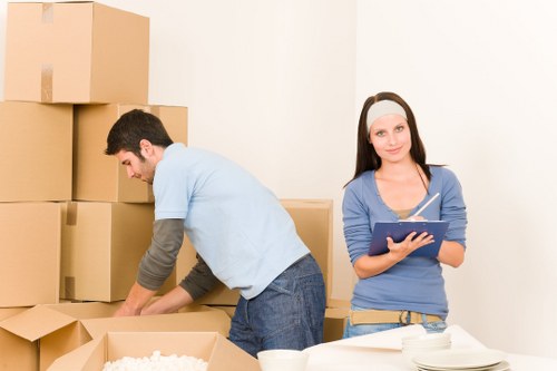 Local Camden moving truck loading furniture and boxes with care